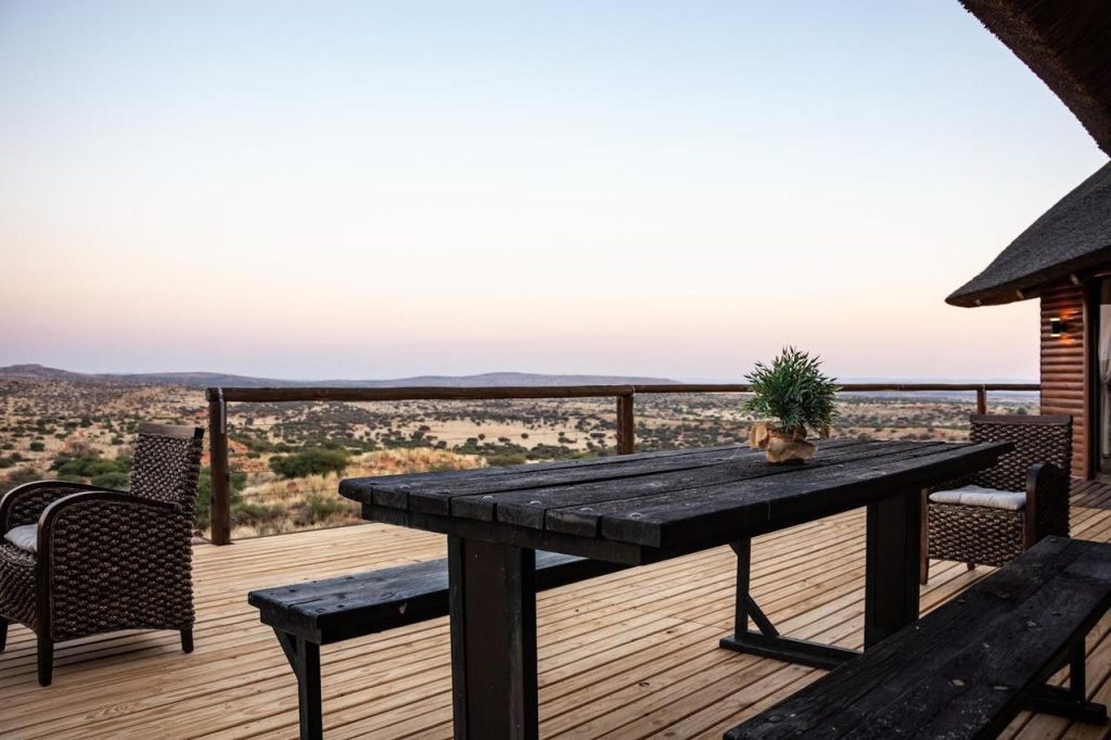 Scenic dining deck overlooking the savanna at Namakwari hunting lodge in Kalahari